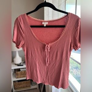 Light pink crop top.